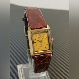 Rado Gold Face Watch with Rich Red Strap